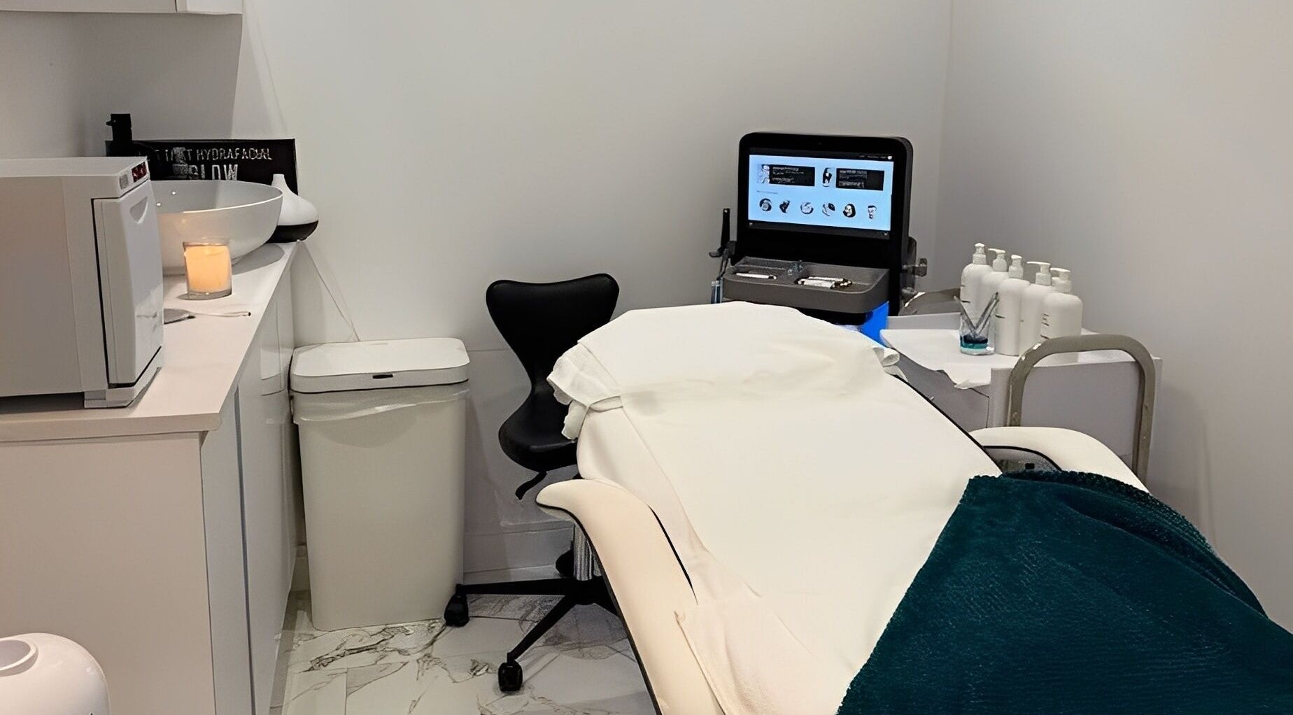 Elegant treatment room at Glam Haus Clinic, Coventry, England. Relaxing ambiance with modern equipment.