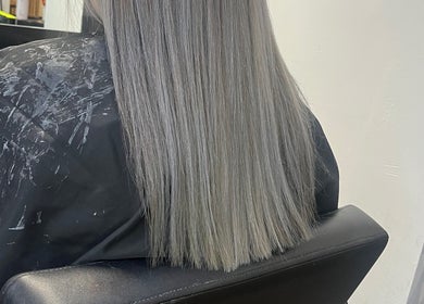 Client's sleek silver hair styled at Hairbycjay salon, Leigh, England, GB.