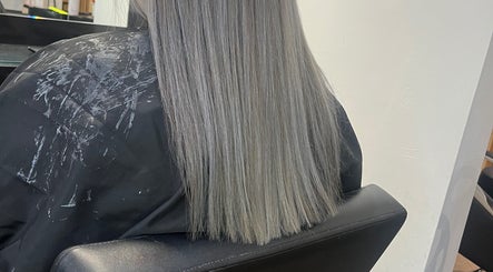 Client's sleek silver hair styled at Hairbycjay salon, Leigh, England, GB.
