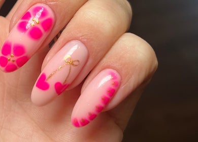 Vibrant pink floral nail art at Beauty by Freya Elise, Leatherhead, England, GB.