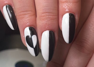 Black and white manicure with heart design at Beauty by Freya Elise, Leatherhead, England, GB.