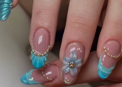 Elegant aqua nail art with floral accents at Beauty by Freya Elise, Leatherhead, England, GB.