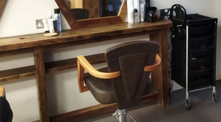 Chic salon station at Hair by Aneta, Grimsby, England, GB, showcasing a rustic wooden styling area.