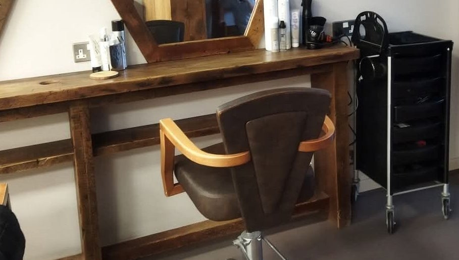 Chic salon chair and styling station at Hair by Aneta, Grimsby, England, GB, offering a rustic aesthetic.