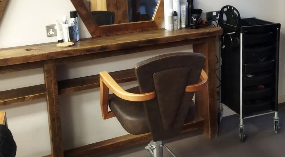Chic salon chair and styling station at Hair by Aneta, Grimsby, England, GB, offering a rustic aesthetic.