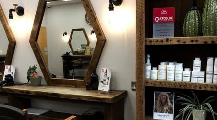 Stylish salon station at Hair by Aneta in Grimsby, England, GB, featuring a rustic mirror and quality products.