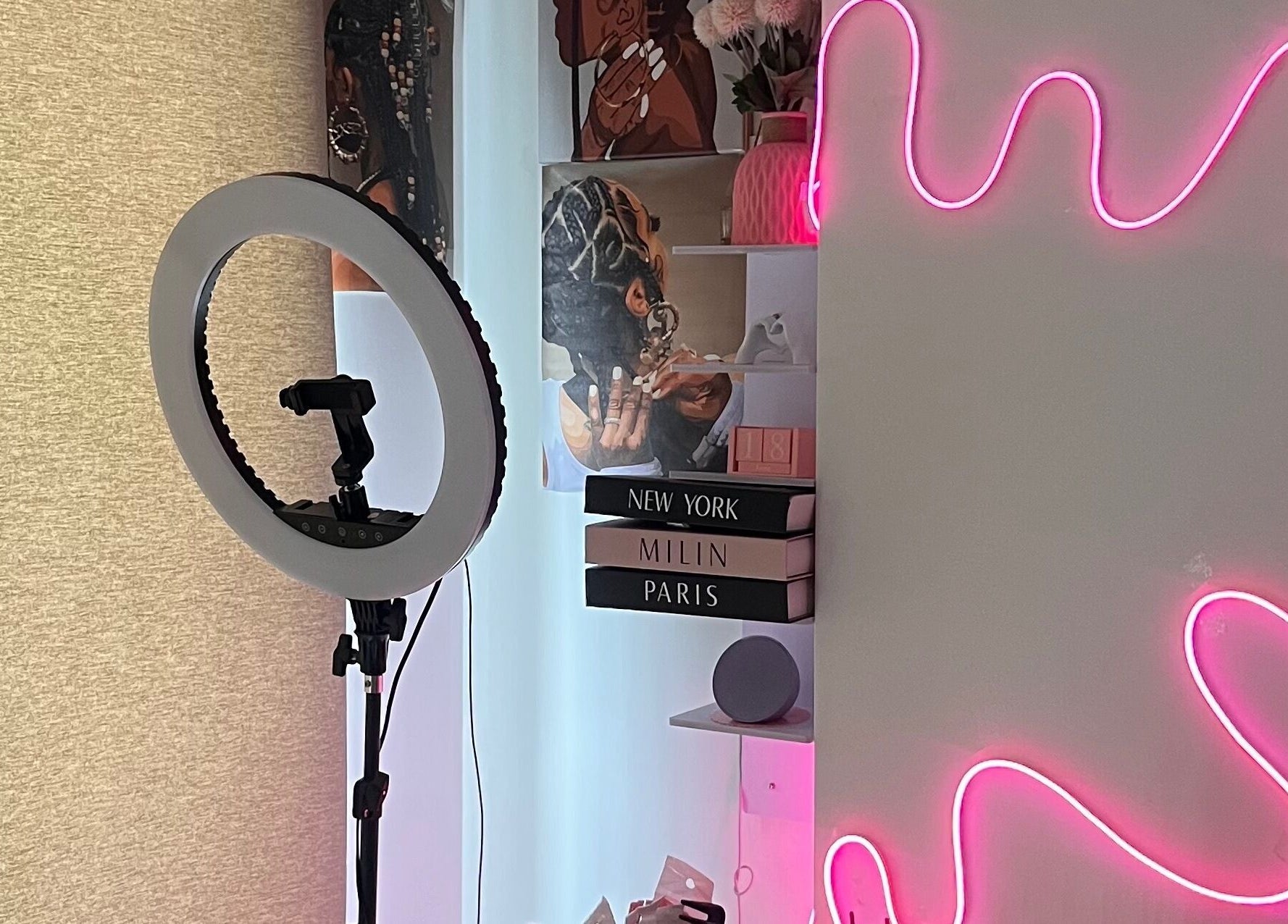 Modern, vibrant beauty setup at Adorned by Jay, Birmingham, England, GB with neon lights and ring light.