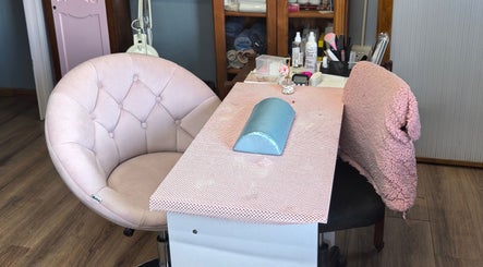 Chic nail station at El Shaddai Beauty Bar, Cape Town, Western Cape, ZA, featuring plush seating and beauty tools.