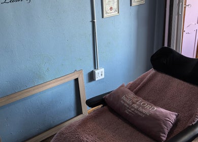 Cozy treatment area at El Shaddai Beauty Bar, Cape Town, Western Cape, ZA, featuring a plush bed and decor.