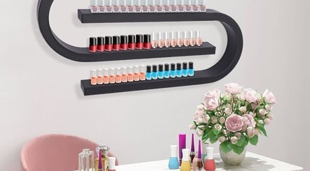 Nail polish showcase at Vivid Nails Studio, St. Michael, Saint James, BB with floral decor.