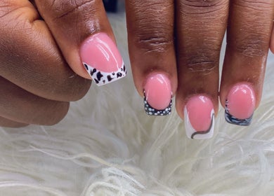 Elegant nail art at Vivid Nails Studio, St. Michael, Saint James, BB. Pink with black and white designs.
