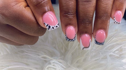 Elegant nail art at Vivid Nails Studio, St. Michael, Saint James, BB. Pink with black and white designs.