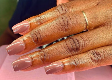 Elegant manicured nails at Vivid Nails Studio, St. Michael, Saint James, BB showcase nude gloss finish.