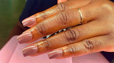 Elegant manicured nails at Vivid Nails Studio, St. Michael, Saint James, BB showcase nude gloss finish.