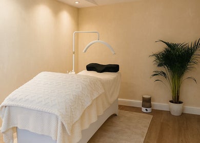 Tranquil massage room at Bexi's Beauty Bar, London, England, GB, featuring a cozy treatment bed.