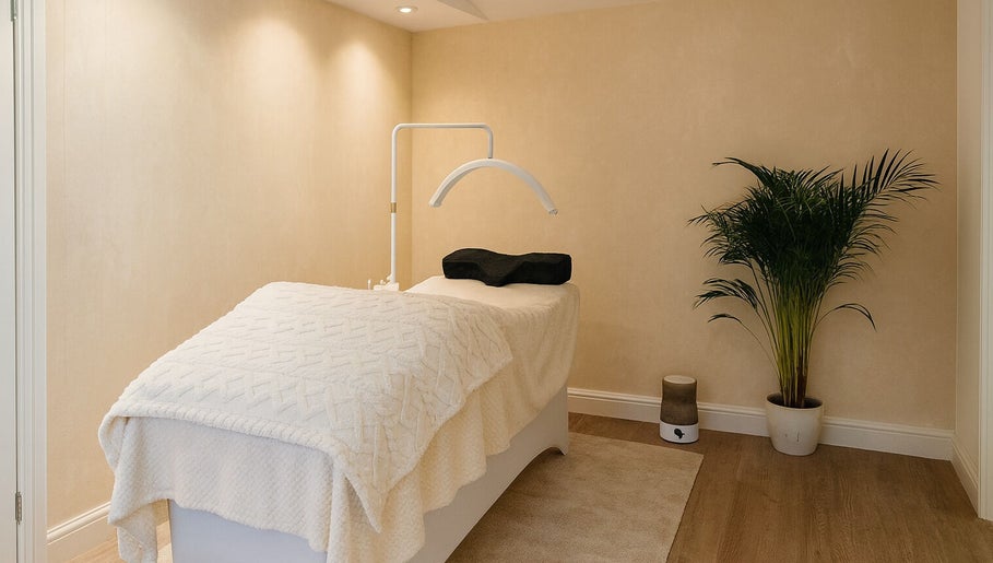 Tranquil treatment room at Bexi's Beauty Bar in London, England, GB, featuring a cozy massage table.