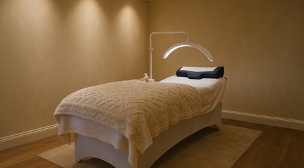 Relaxing treatment room at Bexi's Beauty Bar, London, England, GB, with a cozy spa bed and soft lighting.