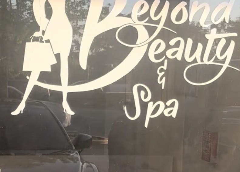 Sign of Beyond Beauty & Spa LLC on storefront, Royal Palm Beach, Florida, US.
