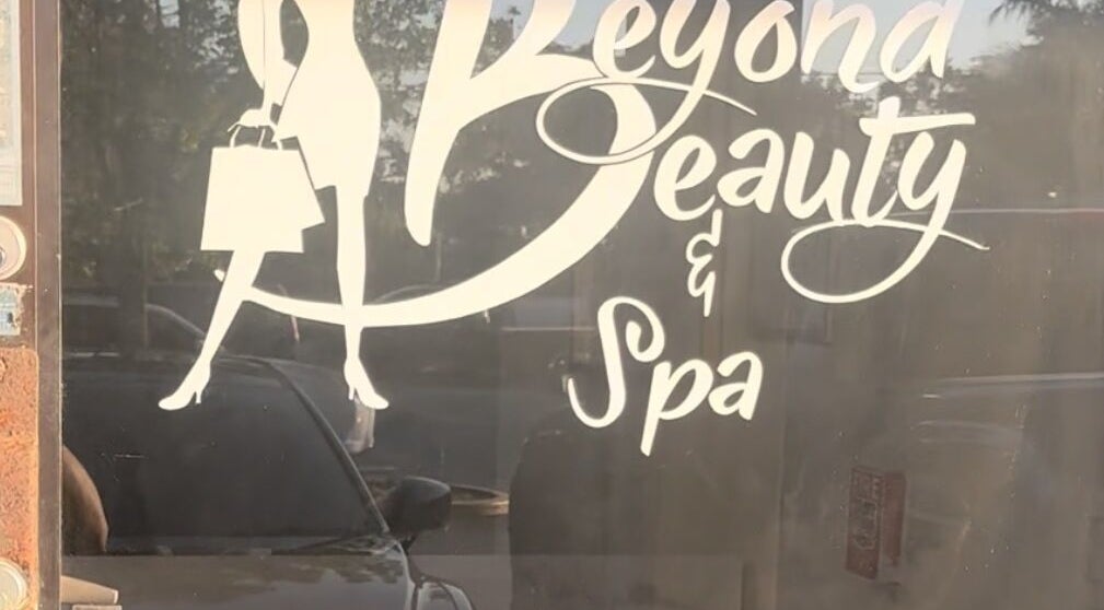 Sign of Beyond Beauty & Spa LLC on storefront, Royal Palm Beach, Florida, US.