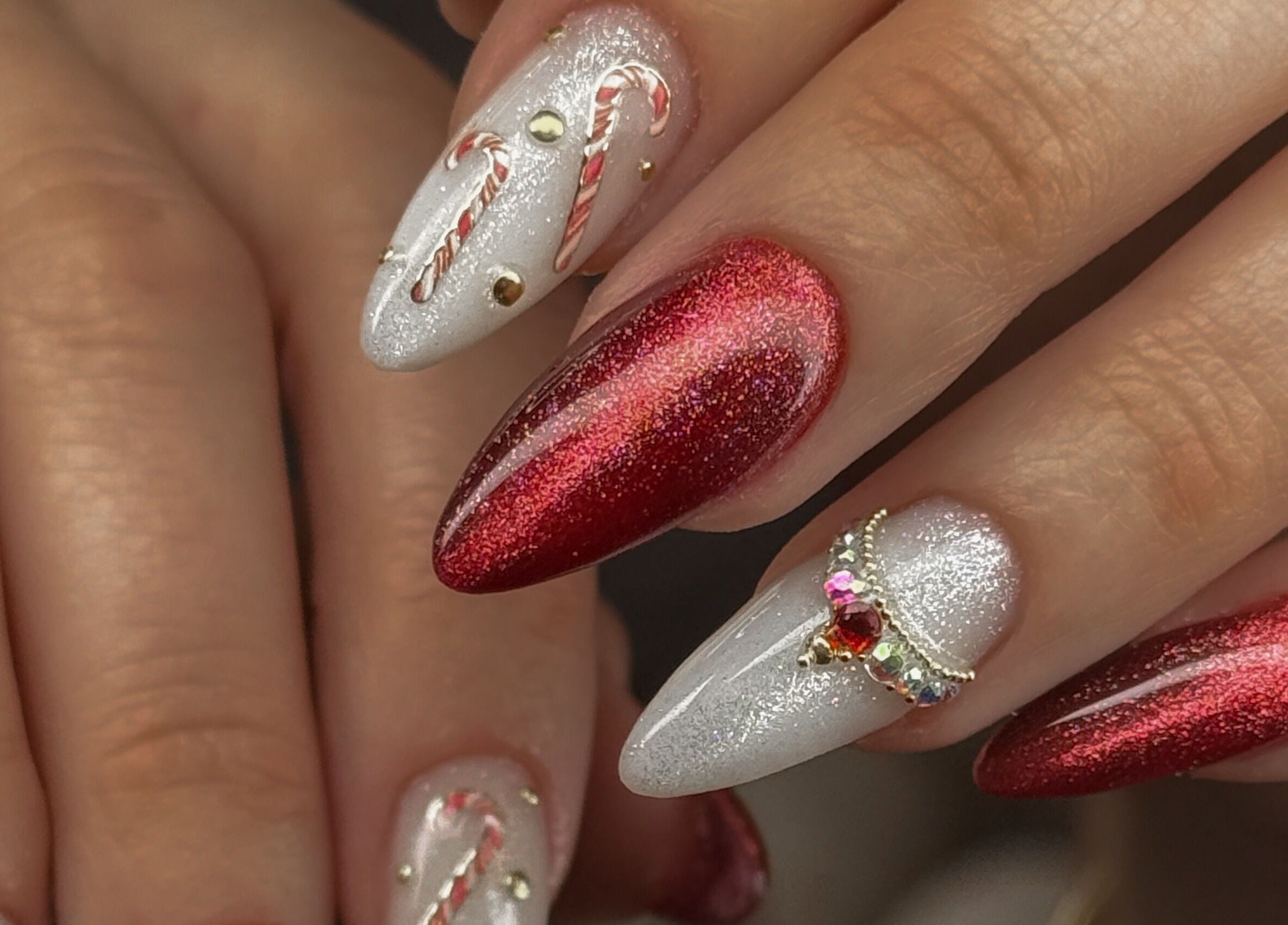 Elegant red and white holiday nail art at Katzby Nail Artistry, Canning Vale, Western Australia, AU.
