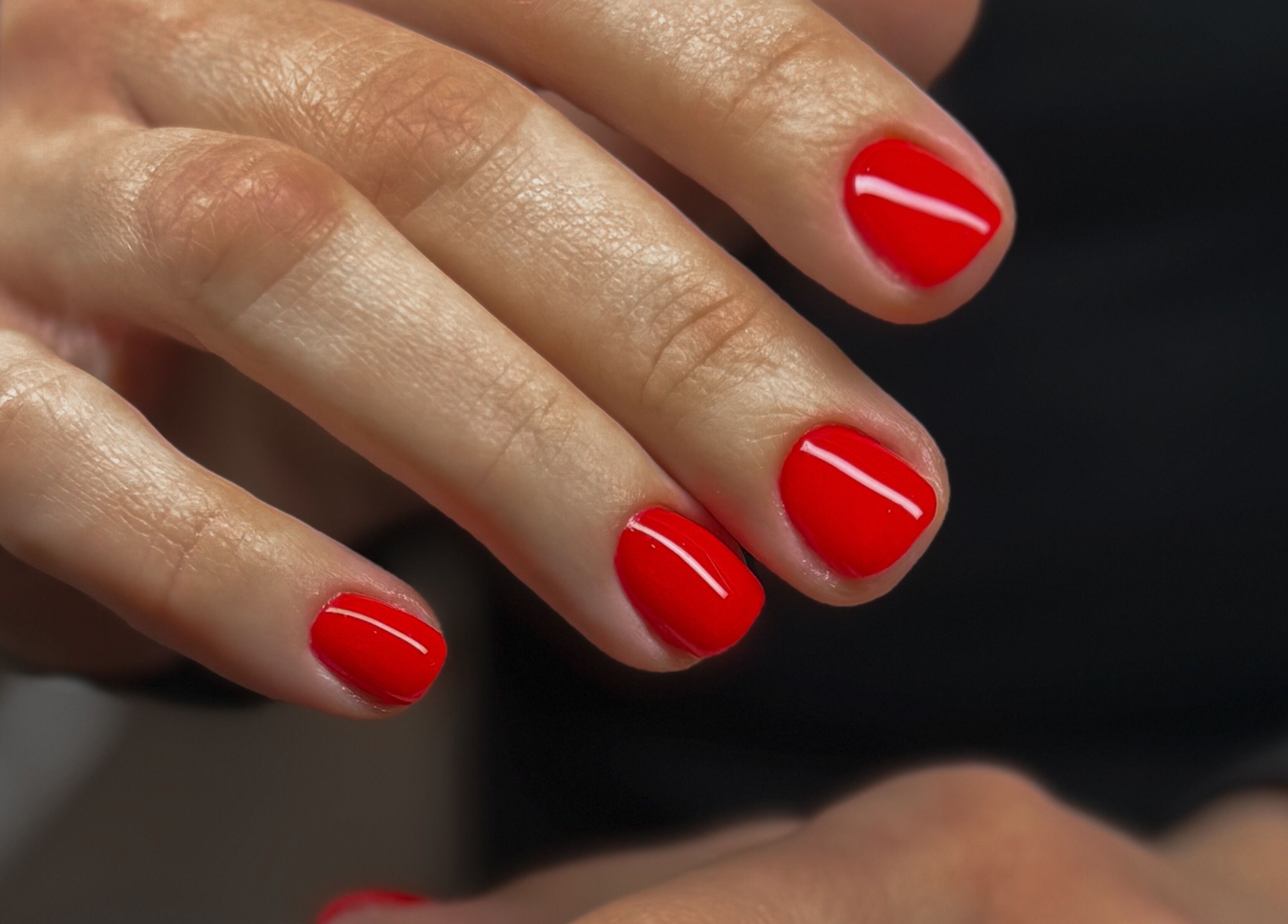 Vibrant red manicured nails at Katzby Nail Artistry, Canning Vale, Western Australia, AU.