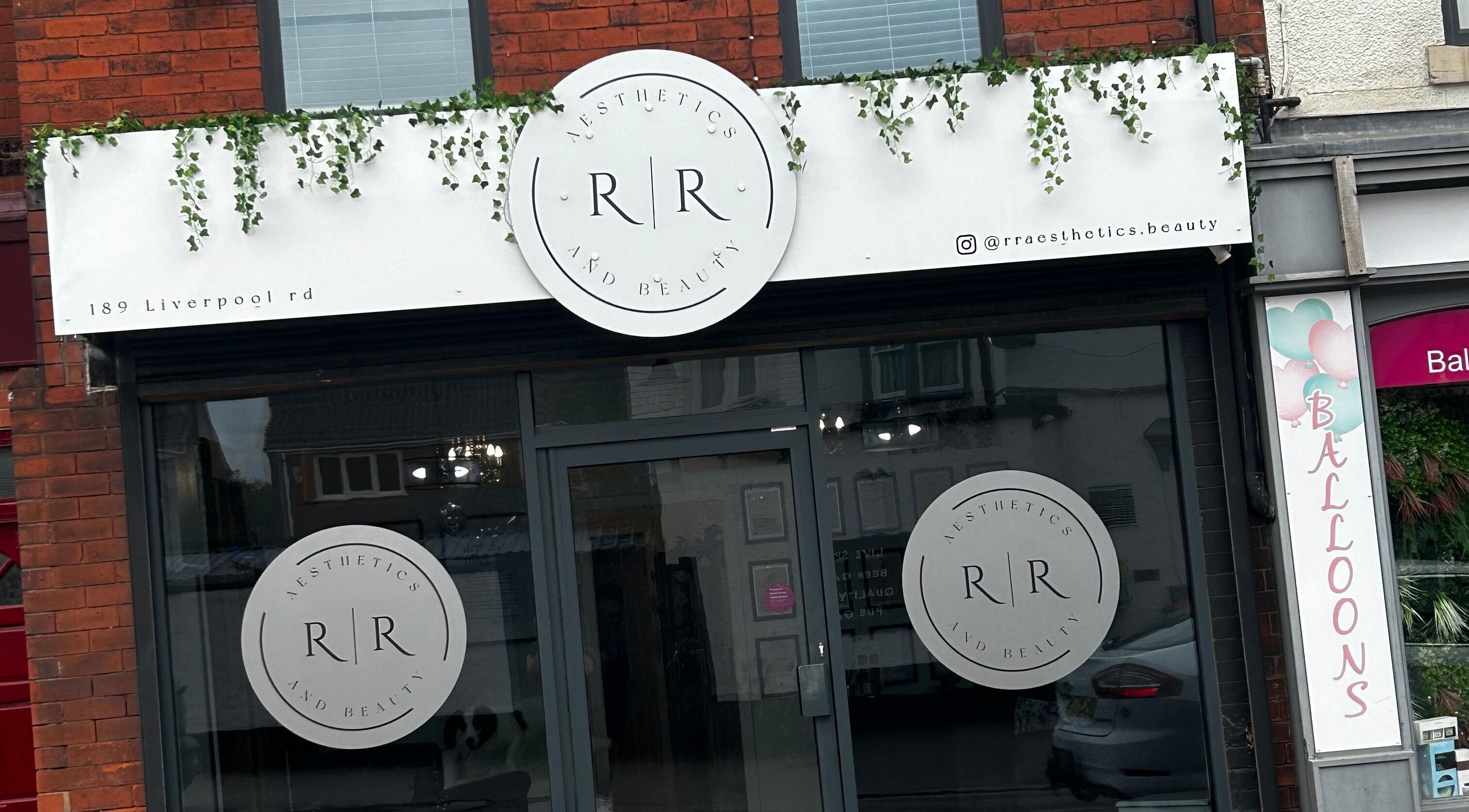Front view of R&R Aesthetics & Beauty in Cadishead, England, showcasing elegant signage and storefront.