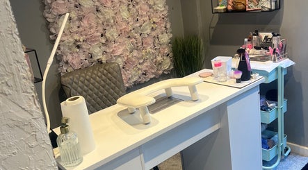 Elegant nail station setup at LAB Tamworth, Tamworth, England, GB with floral decor and beauty products.