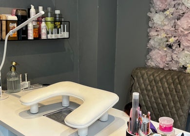 Nail care station at LAB Tamworth with products, located in Tamworth, England, GB against a floral backdrop.