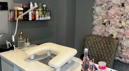 Nail care station at LAB Tamworth with products, located in Tamworth, England, GB against a floral backdrop.
