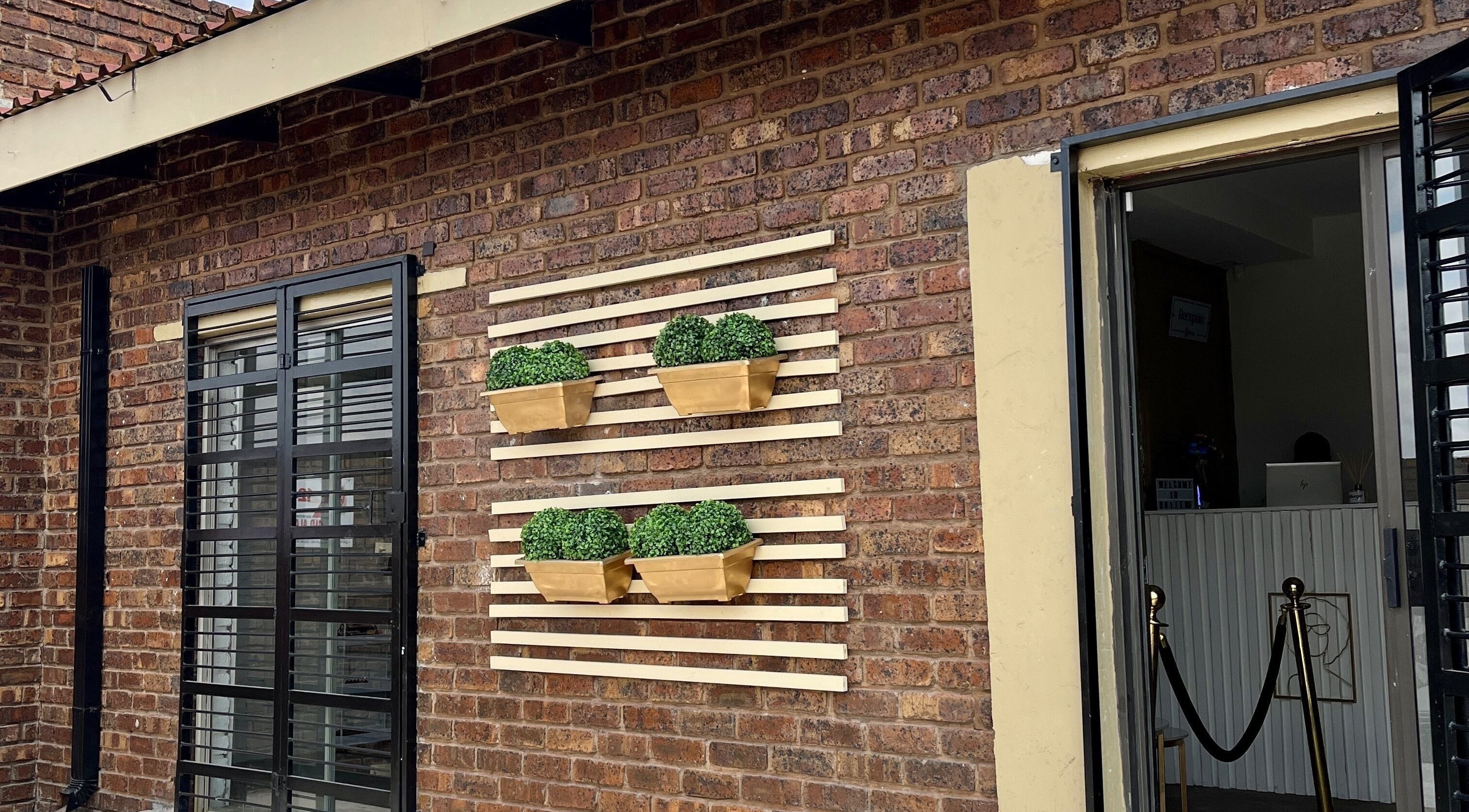 Brick facade with modern decor at Botleng Studio, Middelburg, Mpumalanga, ZA.