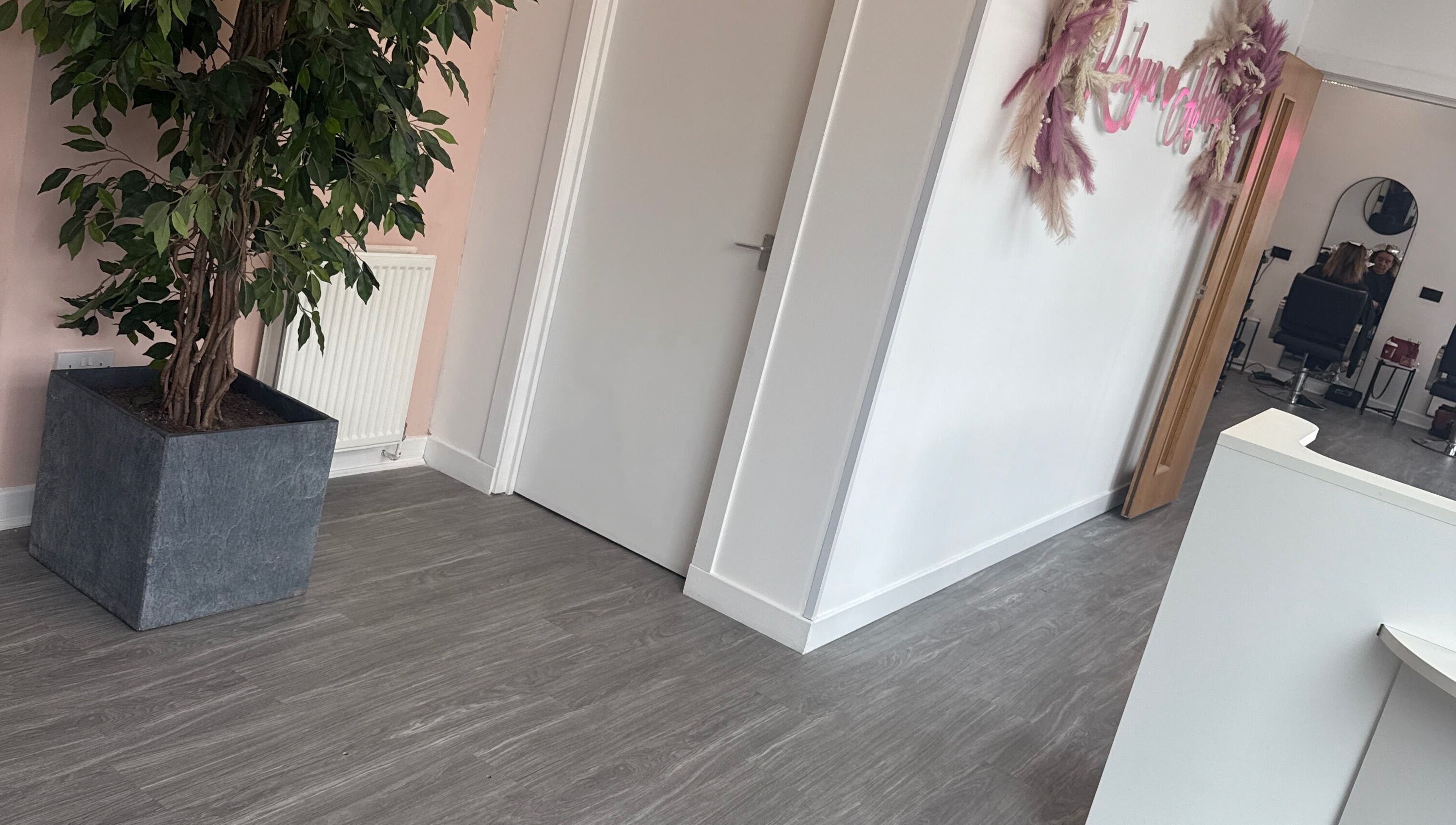 Modern interior of Robyn Ashley Hair & Beauty in Glasgow, Scotland, GB, featuring stylish decor and a welcoming atmosphere.