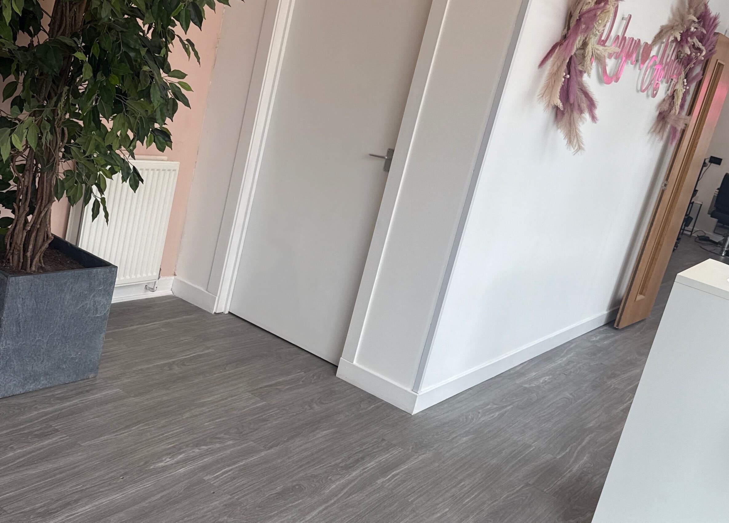 Modern interior of Robyn Ashley Hair & Beauty in Glasgow, Scotland, GB, featuring stylish decor and a welcoming atmosphere.