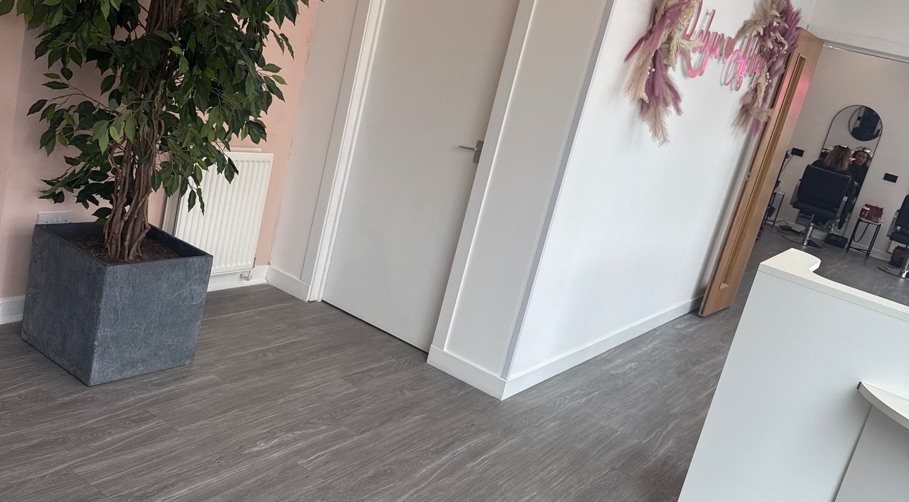 Modern interior of Robyn Ashley Hair & Beauty in Glasgow, Scotland, GB, featuring stylish decor and a welcoming atmosphere.