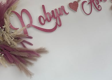 Robyn Ashley Hair & Beauty sign with pink florals in Glasgow, Scotland, GB.