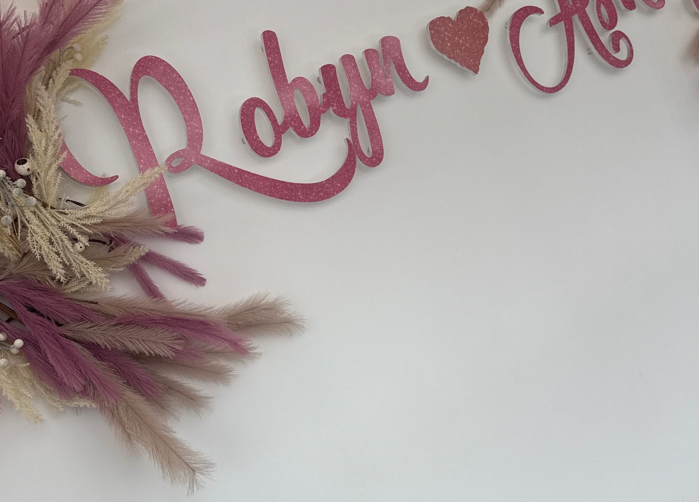 Robyn Ashley Hair & Beauty sign with pink florals in Glasgow, Scotland, GB.