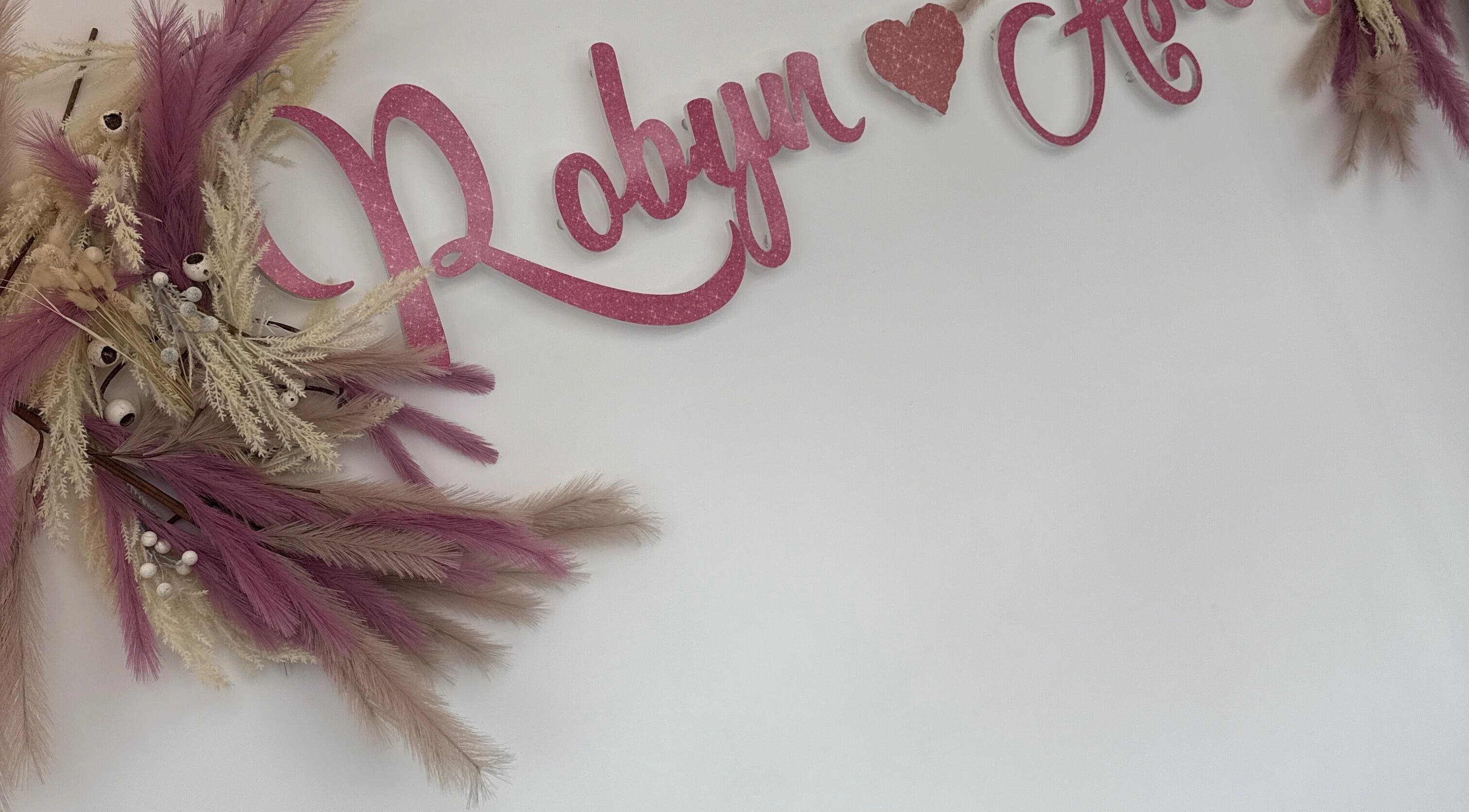 Robyn Ashley Hair & Beauty sign with pink florals in Glasgow, Scotland, GB.