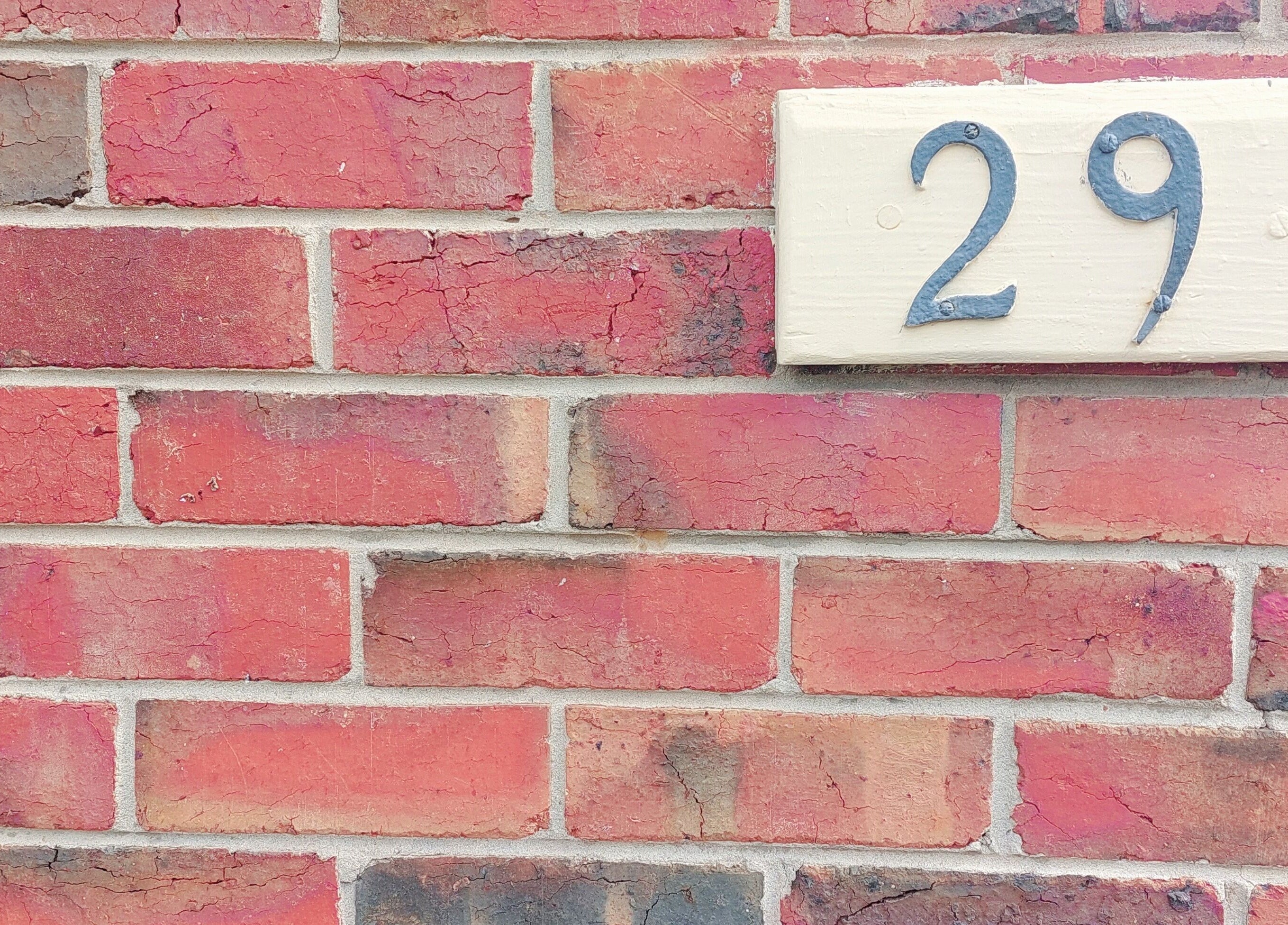 Brick facade with number 29, marking Facial Healing Co.'s entrance in Ormond, Victoria, AU.