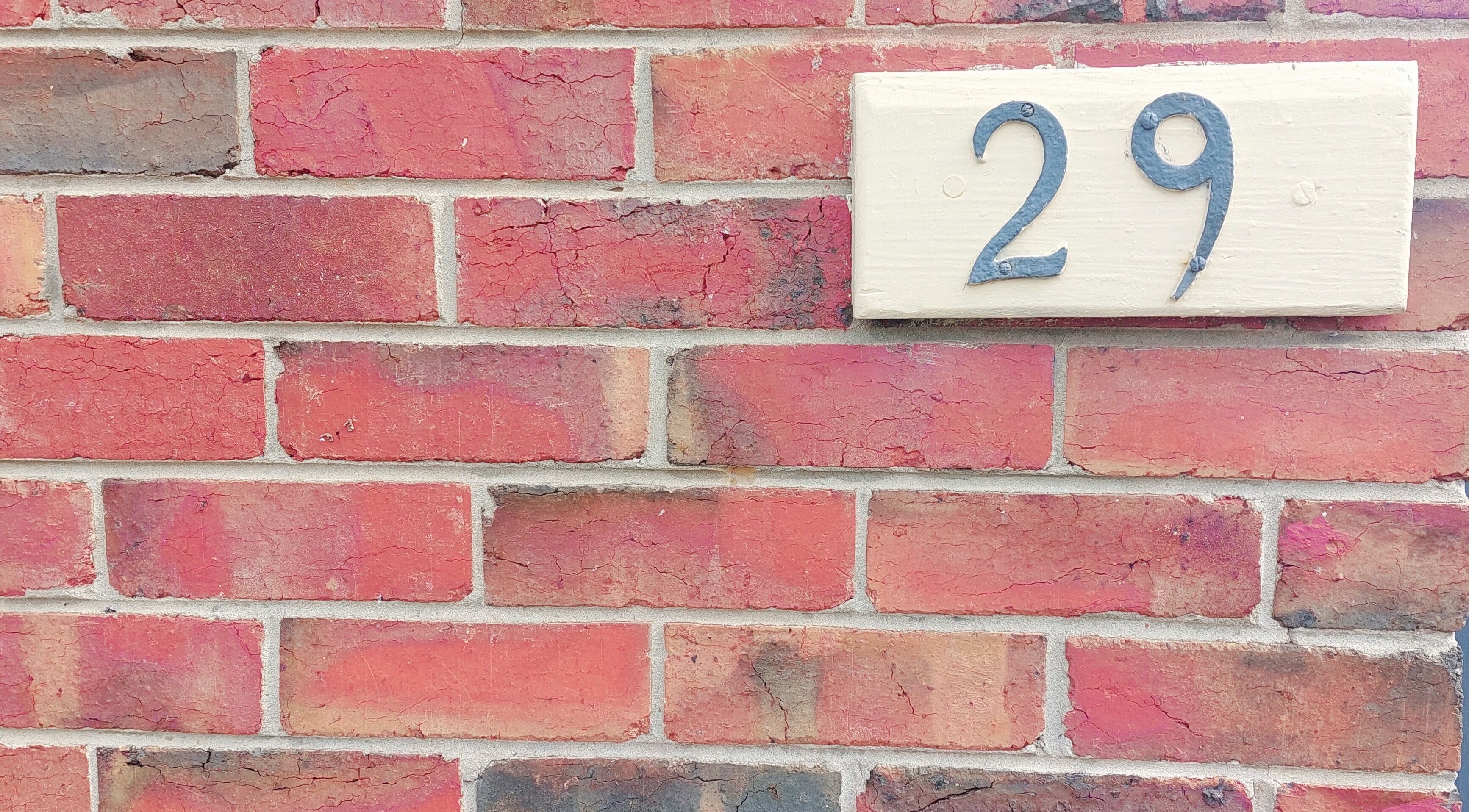 Brick facade with number 29, marking Facial Healing Co.'s entrance in Ormond, Victoria, AU.