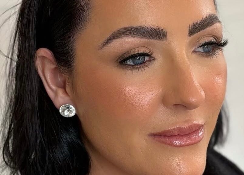 Flawless makeup look by Makeup by Lucy in Dundee, Scotland, GB with bold brows and subtle shimmer.