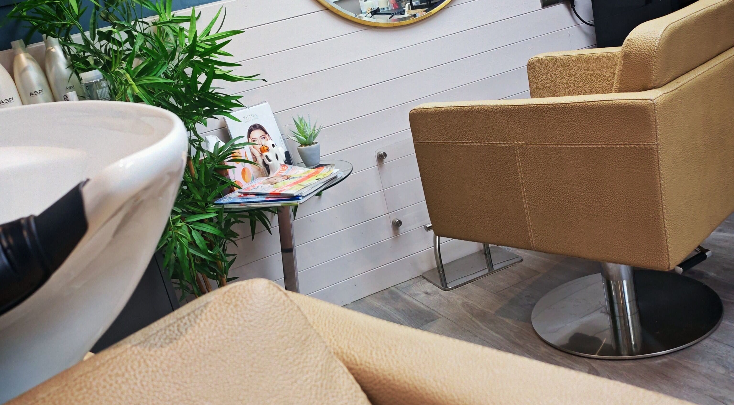 Stylish beauty salon interior at Luna Blush in Highworth, England, GB, featuring chic decor and comfortable seating.