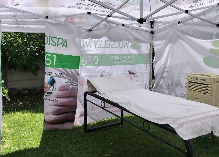 Relaxing space at Wolseley Mobile MediSpa, Wolseley, Western Cape, ZA, featuring a treatment bed under a canopy.