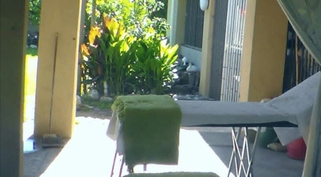 Tranquil outdoor setting at Wolseley Mobile MediSpa, Wolseley, Western Cape, ZA, with greenery and massage table.