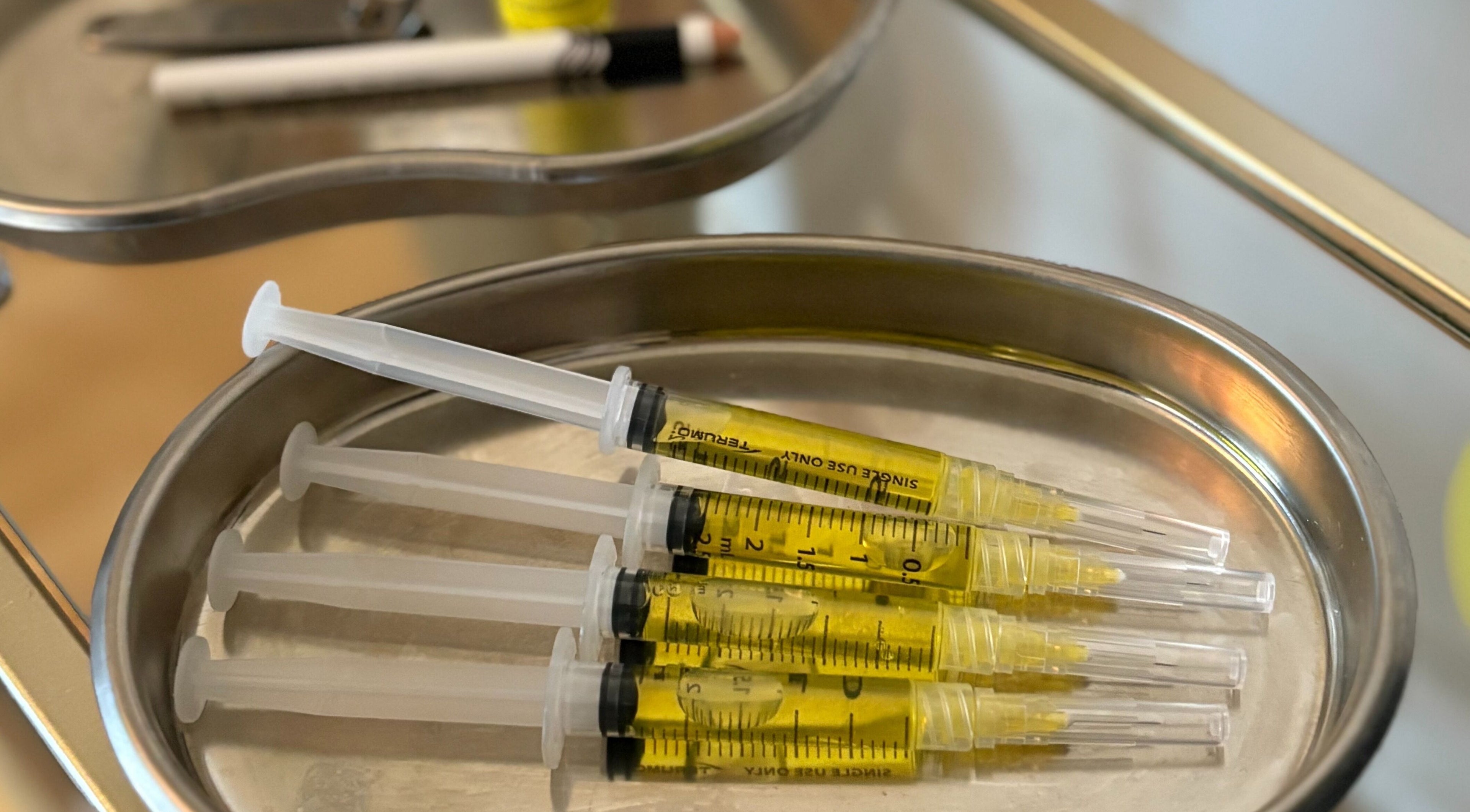 Injectable serums on a tray at Revive Aesthetic Lab, London, England, GB, showcasing advanced skincare.