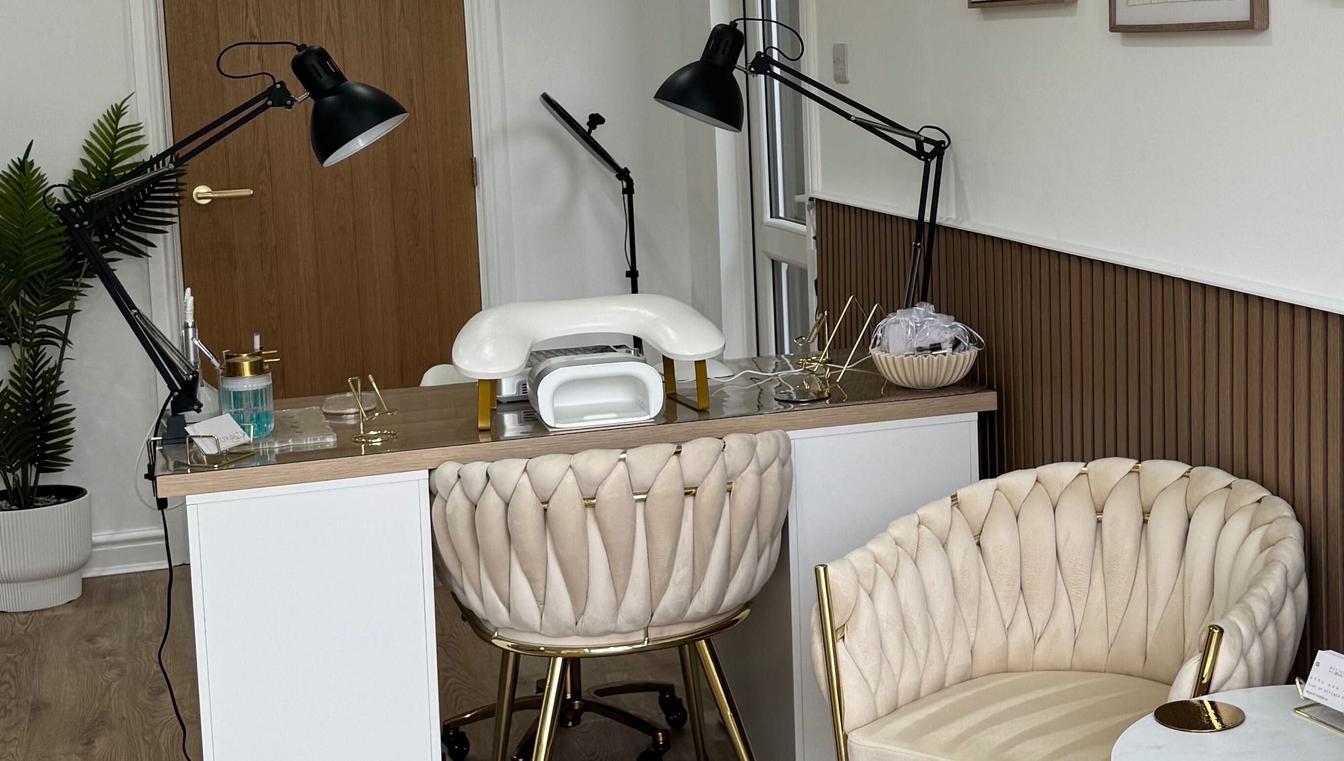 Chic nail station at Defined Studio in Bowers Gifford, England, GB with plush seating and modern decor.