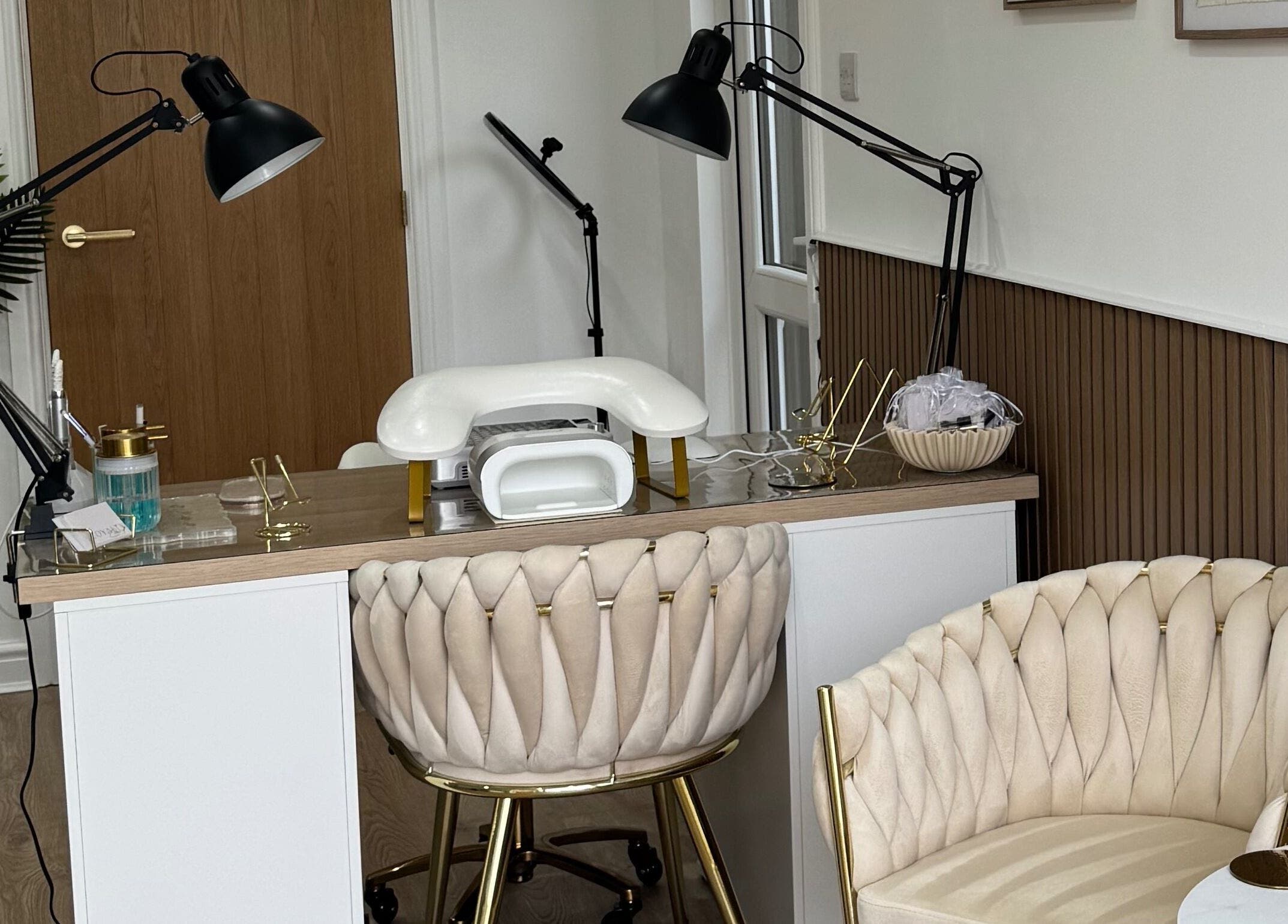 Chic nail station at Defined Studio in Bowers Gifford, England, GB with plush seating and modern decor.