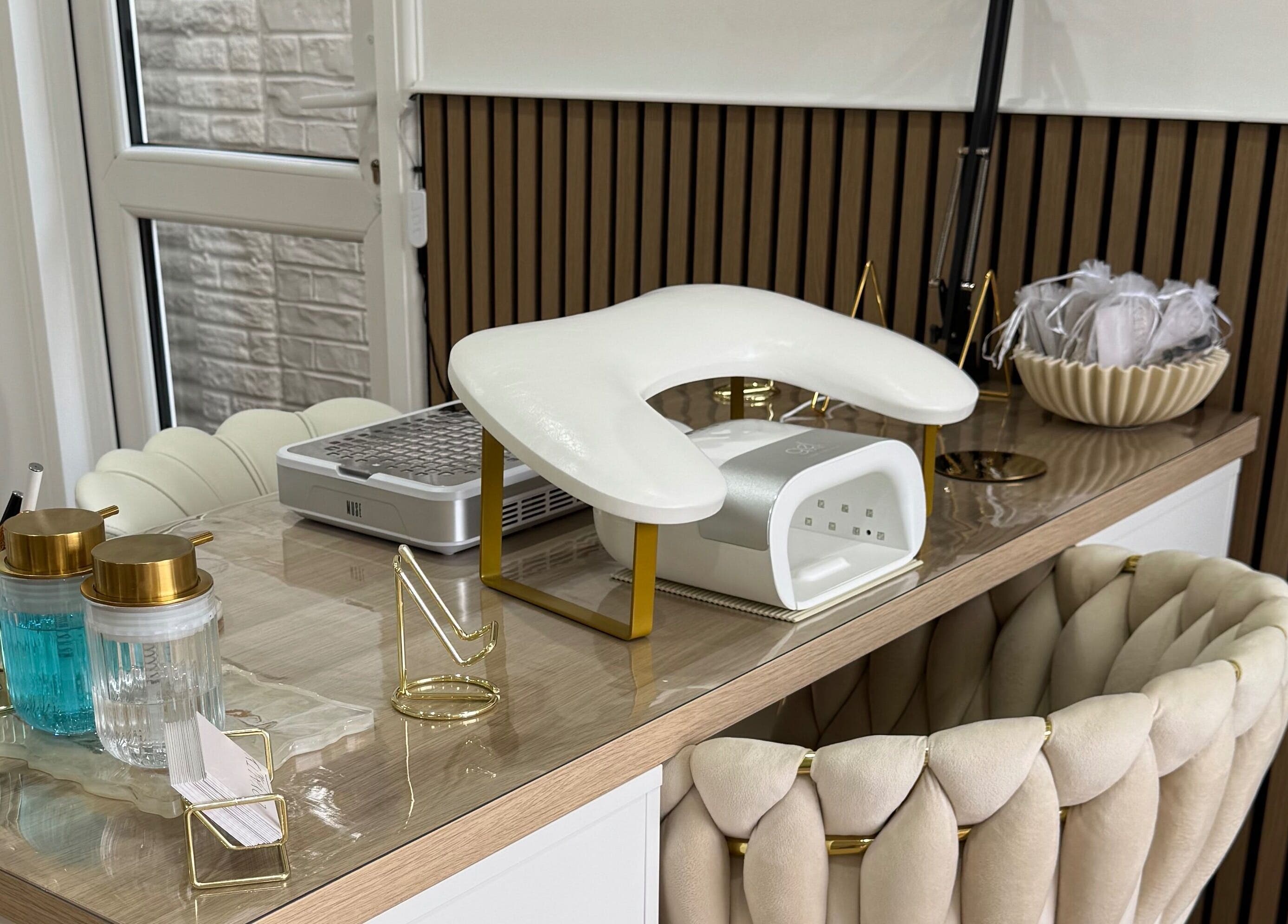 Luxurious nail station at Defined Studio, Bowers Gifford, England, GB with plush seating and modern equipment.