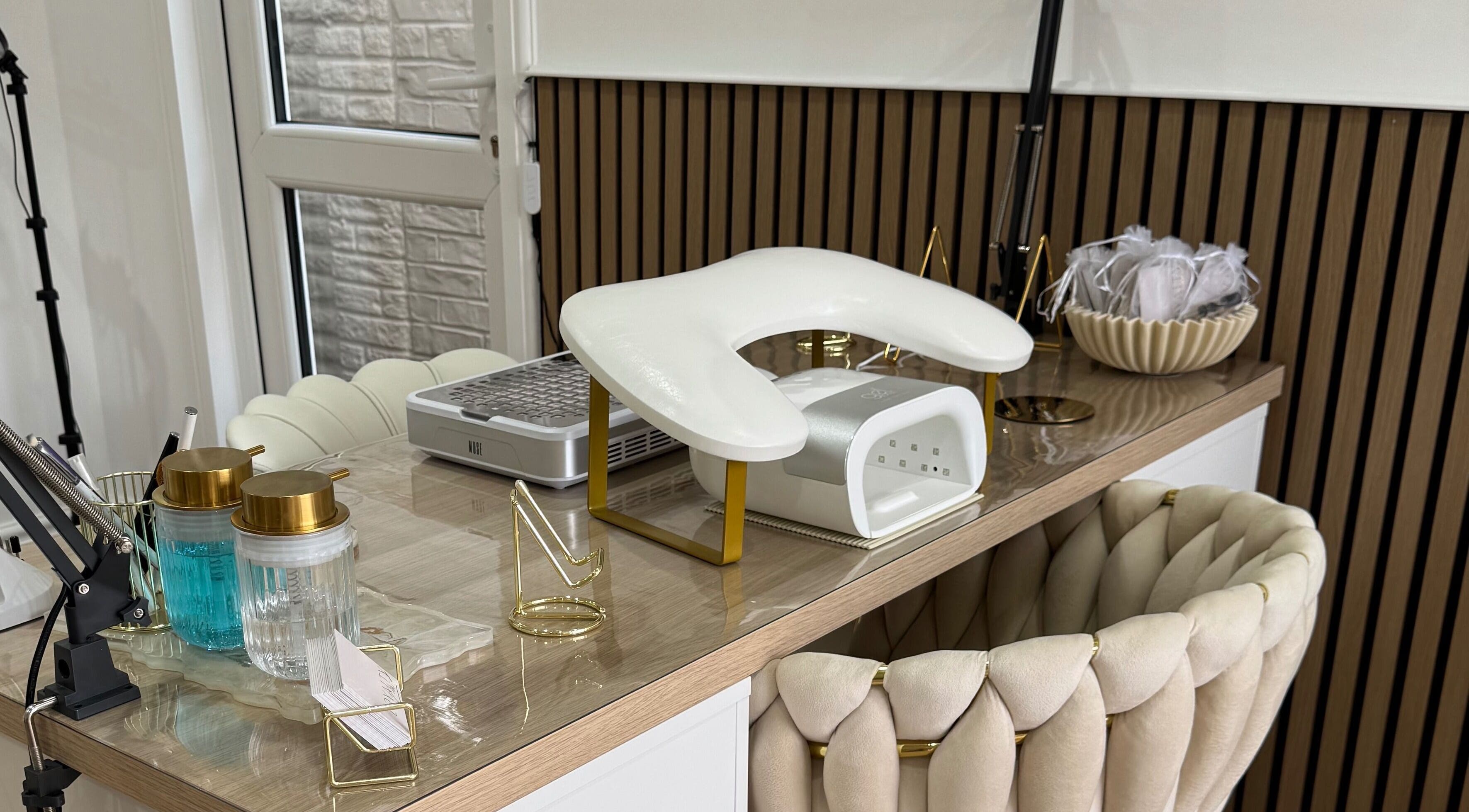 Luxurious nail station at Defined Studio, Bowers Gifford, England, GB with plush seating and modern equipment.