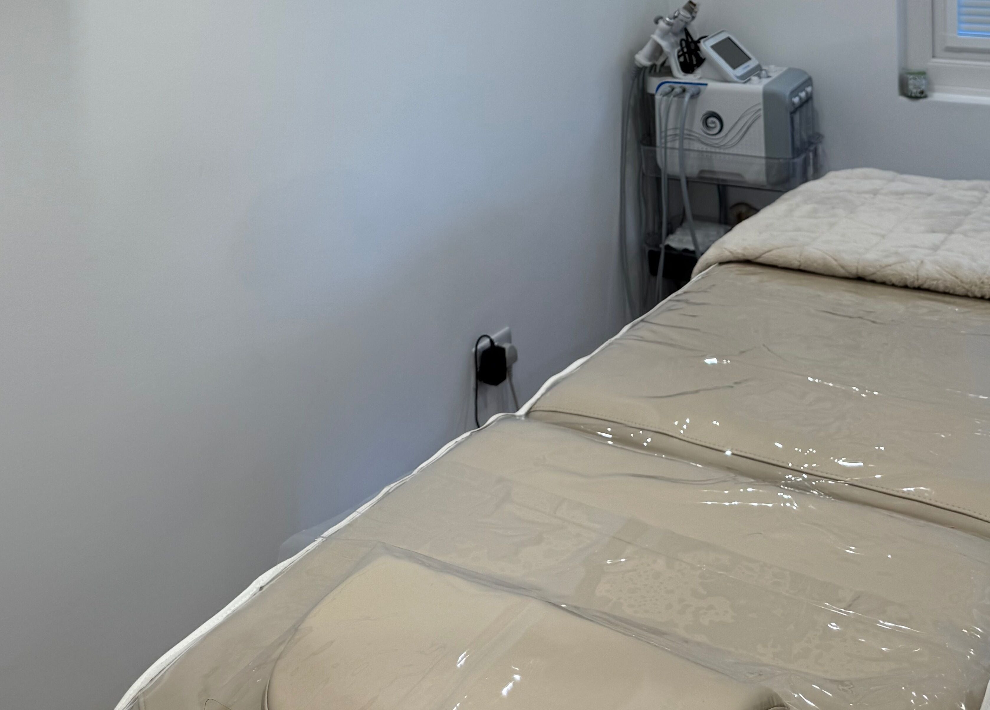 Treatment bed and equipment at Defined Studio, Bowers Gifford, England, GB for wellness services.