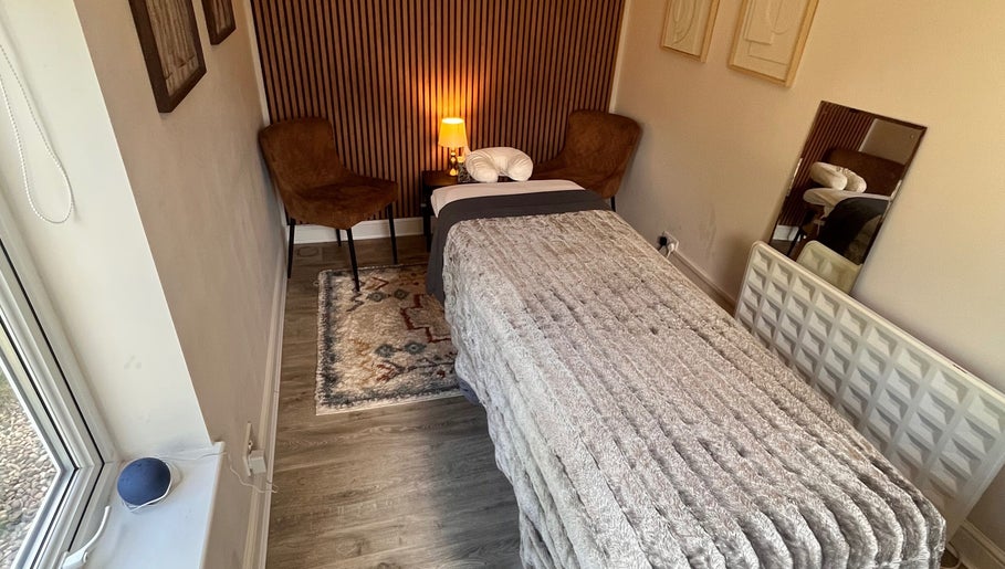 Relaxing therapy room at Woodview Holistic Therapies, Sheffield, England, GB, with a plush treatment bed.