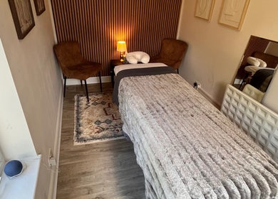 Relaxing therapy room at Woodview Holistic Therapies, Sheffield, England, GB, with a plush treatment bed.